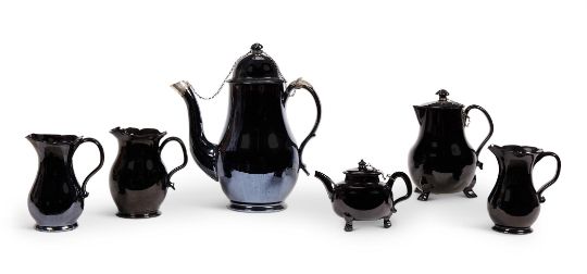 A LOW COUNTRIES BLACK GLAZED POTTERY AND SILVER MOUNTED COFFEE POT AND COVER (TERRE DE NAMUR)