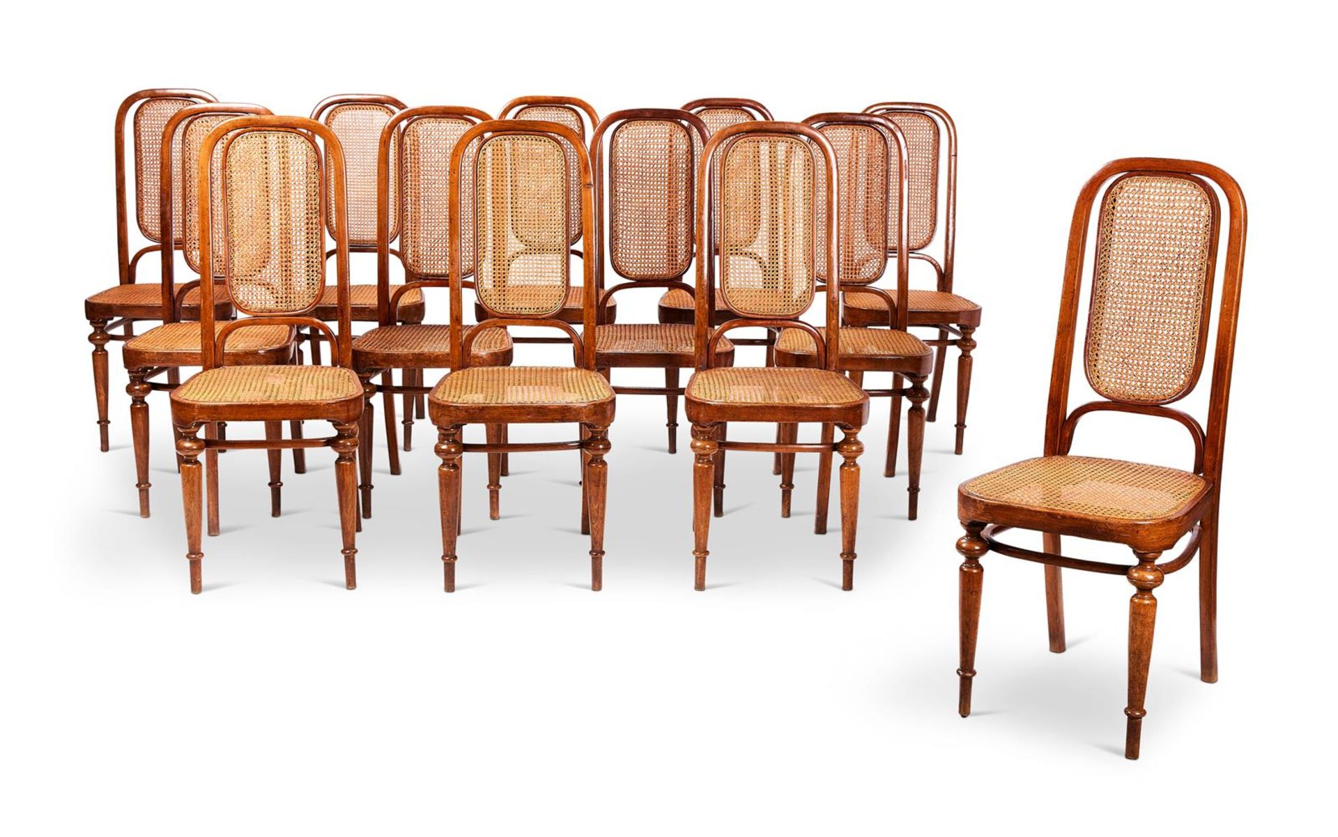 A SET OF THIRTEEN AUSTRIAN BEECHWOOD CHAIRS MANUFACTURED BY THONET