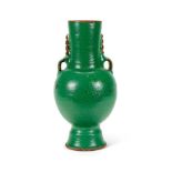 A GREEN AND WHITE GLAZED RED POTTERY TWO-HANDLED VASE SOUTHERN FRENCH OR MORROCAN, MODERN