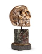 A MADAGASCAN CARVED SEPTARIAN NODULE SKULL 20TH CENTURY