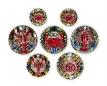 A GROUP OF SEVEN SIMILAR CALDAS DA RAINHA MAIOLICA PLATES IN BERNARD PALISSY STYLE, PORTUGAL