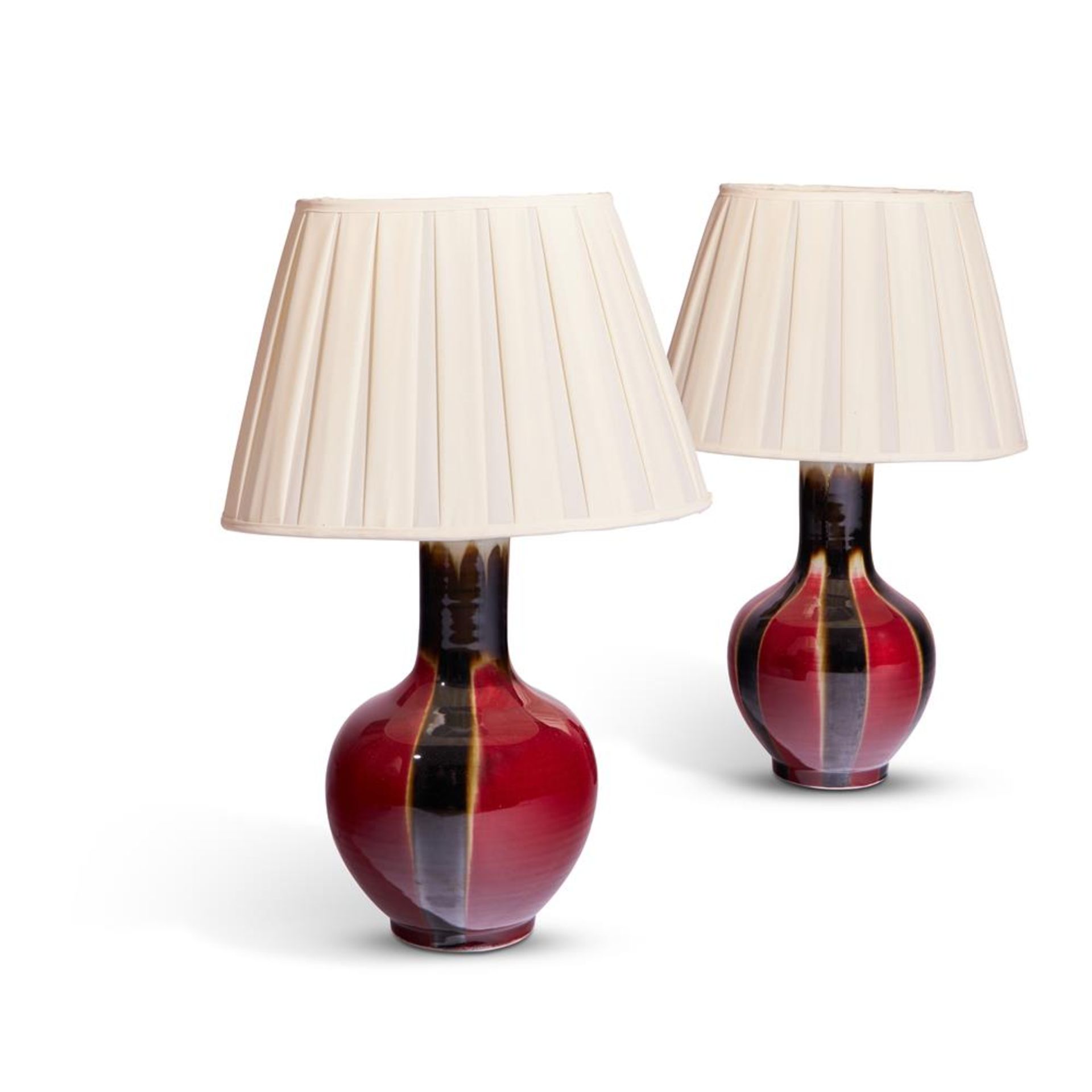 A PAIR OF RED AND BLACK GLAZED CERAMIC LAMPS, MODERN
