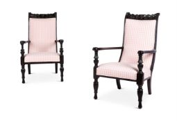 Y A MATCHED PAIR OF ANGLO-INDIAN EBONY OPEN ARMCHAIRS, SECOND HALF 19TH CENTURY