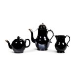 A LOW COUNTRIES BLACK GLAZED POTTERY, SILVER MOUNTED COFFEE POT AND COVER (TERRE DE NAMUR)