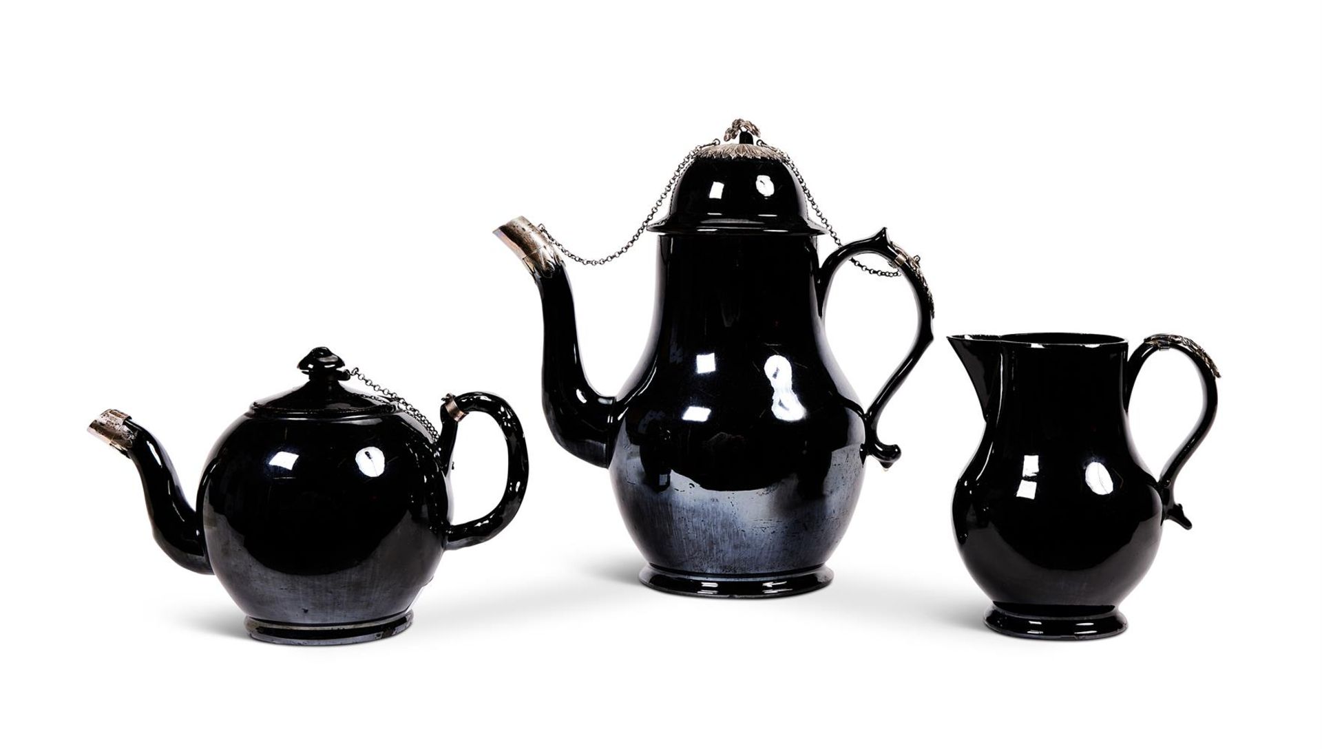 A LOW COUNTRIES BLACK GLAZED POTTERY, SILVER MOUNTED COFFEE POT AND COVER (TERRE DE NAMUR)