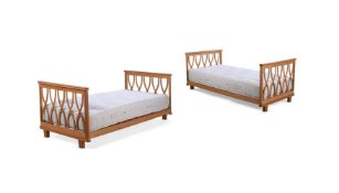 A PAIR OF OAK SINGLE BEDS FRENCH, CIRCA 1950s
