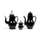 A LOW COUNTRIES BLACK GLAZED POTTERY, SILVER MOUNTED COFFEE POT AND COVER (TERRE DE NAMUR)