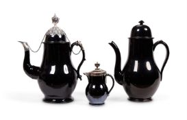 A LOW COUNTRIES BLACK GLAZED POTTERY, SILVER MOUNTED COFFEE POT AND COVER (TERRE DE NAMUR)