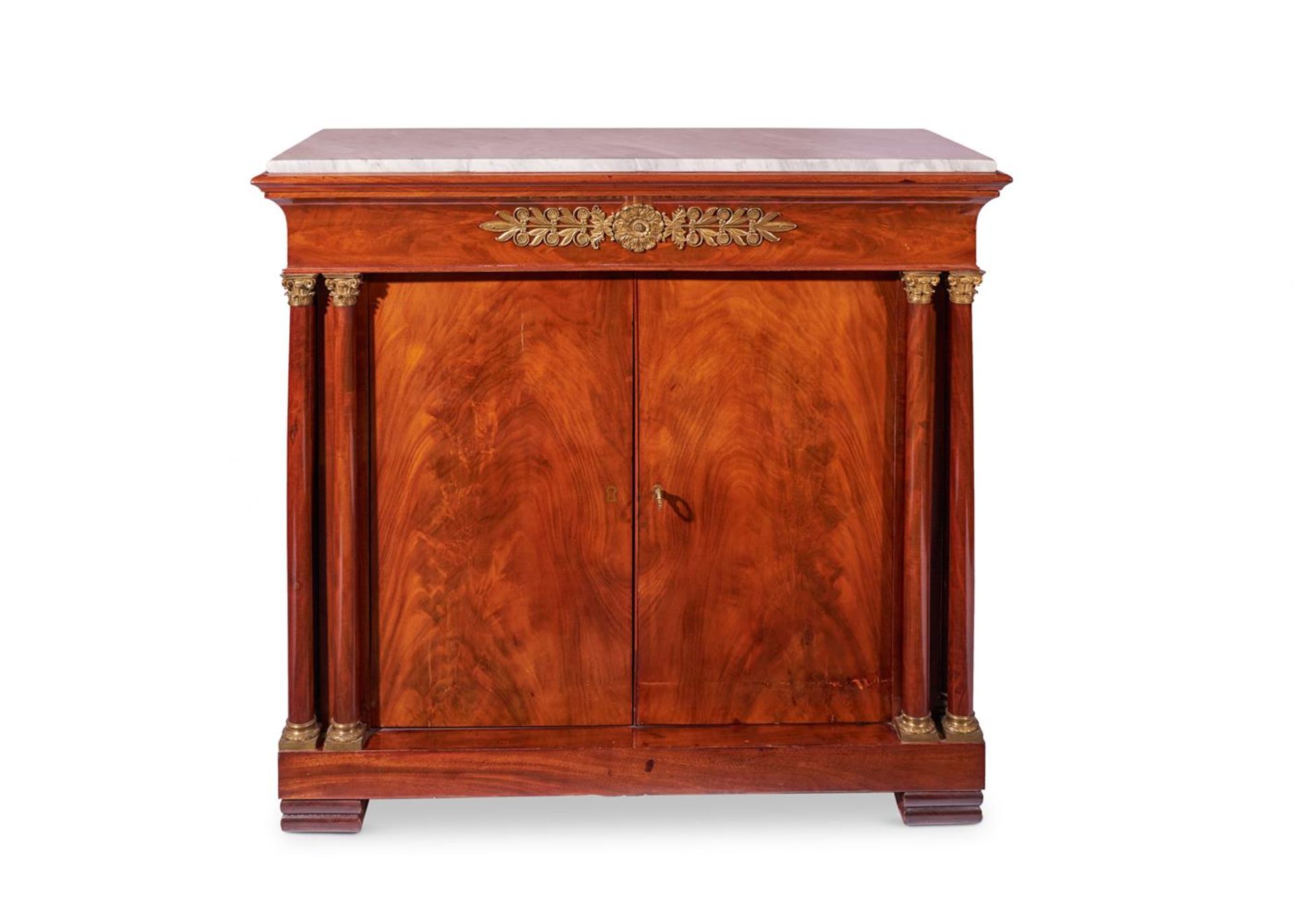 AN EMPIRE ORMOLU MOUNTED MAHOGANY SIDE CABINET FRENCH, CIRCA 1810