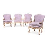 A SET OF FOUR ITALIAN CREAM, POLYCHROME AND GILT DECORATED OPEN ARMCHAIRS