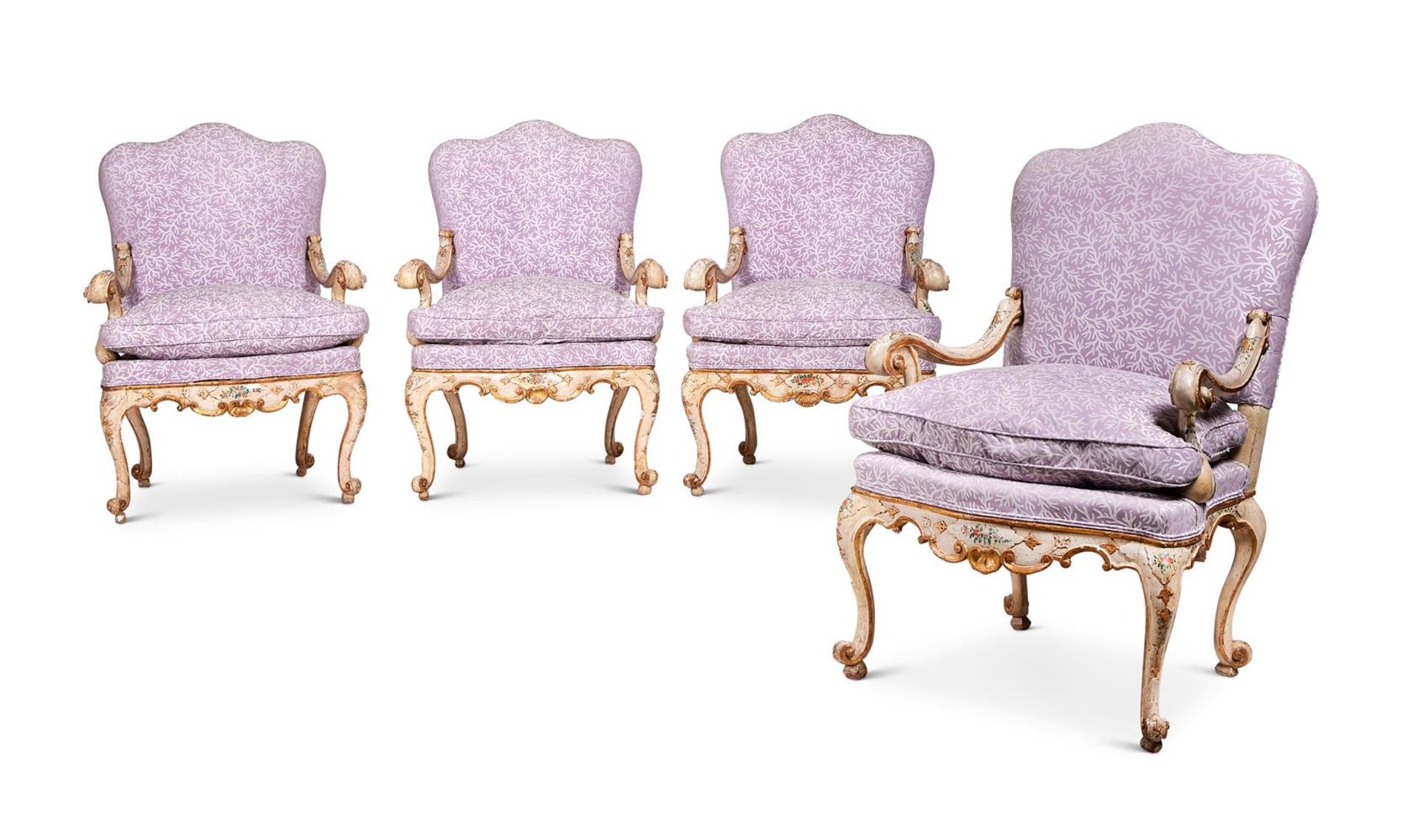 A SET OF FOUR ITALIAN CREAM, POLYCHROME AND GILT DECORATED OPEN ARMCHAIRS