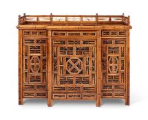 A BAMBOO, RATTAN, WALNUT AND PART EBONISED 'CHINOISERIE' BREAKFRONT SIDE CABINET