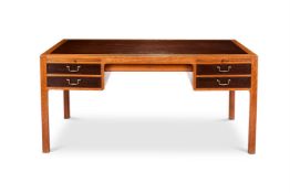 A DANISH OAK DESK ATTRIBUTED TO ERNST KUHN (1890-1948), RETAILED BY NORMINA