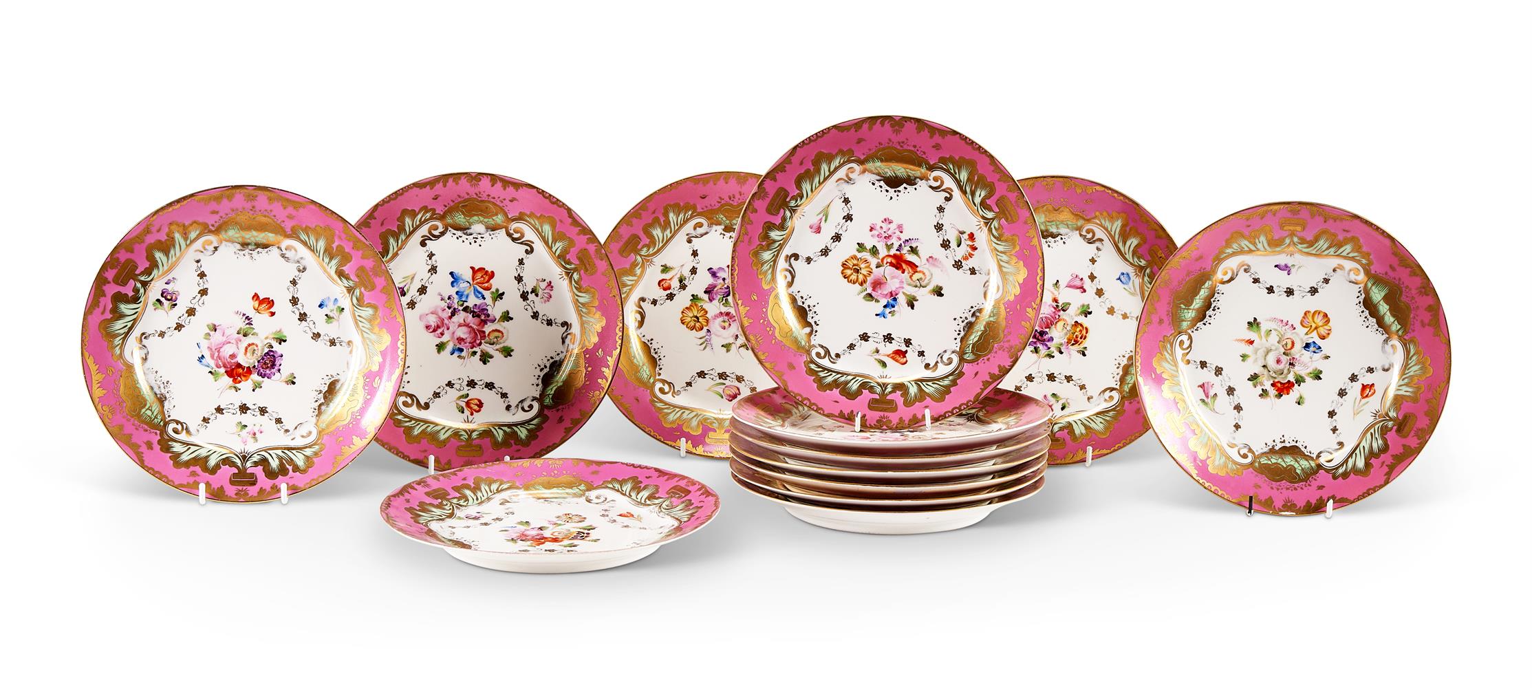 THIRTEEN LIMOGES PORCELAIN PINK-GROUND ROCOCO REVIVAL DESSERT PLATES, CIRCA 1900