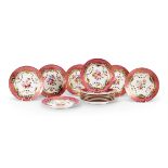 THIRTEEN LIMOGES PORCELAIN PINK-GROUND ROCOCO REVIVAL DESSERT PLATES, CIRCA 1900