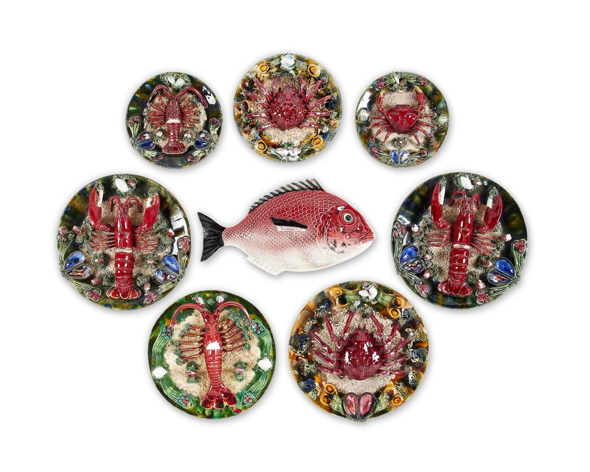 A GROUP OF SEVEN SIMILAR CALDAS DA RAINHA MAIOLICA PLATES IN BERNARD PALISSY STYLE