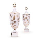 A PAIR OF PORCELAIN BOTANIST GANJA URNS AND COVERS FOR JONATHAN ADLER