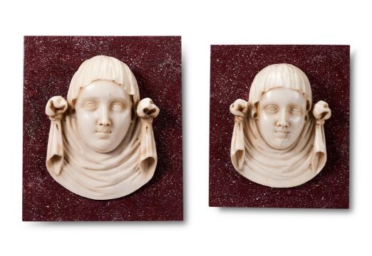 A PAIR OF ITALIAN STATUARY MARBLE FEMALE MASK PANELS, LATE 16TH/EARLY 17TH CENTURY