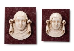 A PAIR OF ITALIAN STATUARY MARBLE FEMALE MASK PANELS, 17TH/18TH CENTURY