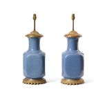 A PAIR OF GILT METAL MOUNTED BLUE CRACKLE GLAZED PORCELAIN TABLE LAMPS