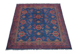 A DONEGAL CARPET, IN USHAK STYLE, approximately 410 x 351cm