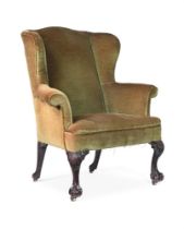 A GEORGE III MAHOGANY AND UPHOLSTERED WING ARMCHAIR, CIRCA 1770