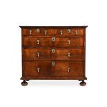 A WILLIAM & MARY FIGURED WALNUT AND FEATHERBANDED CHEST OF DRAWERS, CIRCA 1690