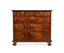 A WILLIAM & MARY FIGURED WALNUT AND FEATHERBANDED CHEST OF DRAWERS, CIRCA 1690