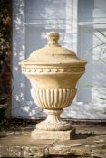 A COMPOSITION STONE LIDDED GARDEN URN, IN THE MANNER OF COADE AND SEALY, CONTEMPORARY