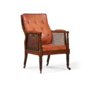 A REGENCY MAHOGANY LIBRARY BERGERE ARMCHAIR, ATTRIBUTED TO GILLOWS, CIRCA 1815