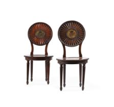 A PAIR OF GEORGE III CARVED MAHOGANY HALL CHAIRS, POSSIBLY BY THOMAS CHIPPENDALE THE YOUNGER