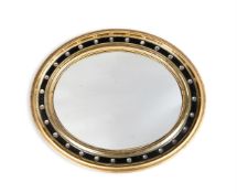 A VICTORIAN GILTWOOD, EBONISED AND CUT GLASS MOUNTED OVAL MIRROR, SECOND HALF 19TH CENTURY