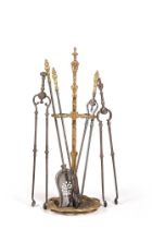 A SET OF THREE POLISHED STEEL AND GILT METAL FIRE IRONS, 19TH CENTURY