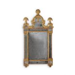 A LARGE CONTINENTAL CARVED GILTWOOD MIRROR, IN THE MANNER OF BURCHARD PRECHT