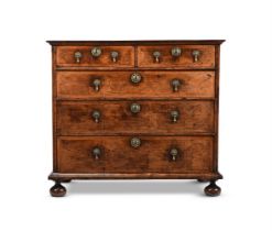 A WILLIAM & MARY FIGURED WALNUT AND FEATHERBANDED CHEST OF DRAWERS, CIRCA 1700