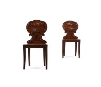 A PAIR OF GEORGE IV CARVED MAHOGANY HALL CHAIRS, ATTRIBUTED TO GILLOWS, CIRCA 1825