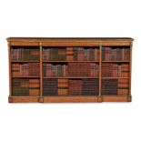 A SATINWOOD, MAHOGANY CROSSBANDED AND GILT METAL MOUNTED BREAKFRONT OPEN BOOKCASE
