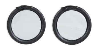 A PAIR OF CARVED WOOD AND BLACK PAINTED CIRCULAR MIRRORS, IN REGENCY STYLE, OF RECENT MANUFACTURE