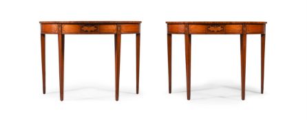 Y A PAIR OF EDWARDIAN SATINWOOD, TULIPWOOD CROSSBANDED AND INLAID DEMI-LUNE CONSOLE TABLES