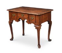 A GEORGE II WALNUT AND CROSSBANDED SIDE TABLE, CIRCA 1735