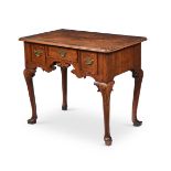 A GEORGE II WALNUT AND CROSSBANDED SIDE TABLE, CIRCA 1735