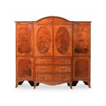 A SATINWOOD AND CROSSBANDED BREAKFRONT WARDROBE OR COMPACTUM, FIRST HALF 19TH CENTURY