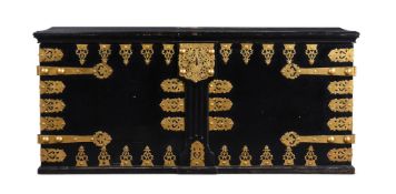 A LARGE EBONISED AND BRASS MOUNTED 'ZANZIBAR' CHEST, EARLY 20TH CENTURY AND LATER