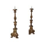 A PAIR OF ITALIAN GILTWOOD ALTAR CANDLESTICKS, 18TH CENTURY