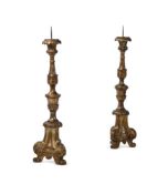 A PAIR OF ITALIAN GILTWOOD ALTAR CANDLESTICKS, 18TH CENTURY