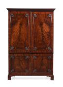 A GEORGE III MAHOGANY LINEN PRESS, IN THE MANNER OF THOMAS CHIPPENDALE, CIRCA 1770