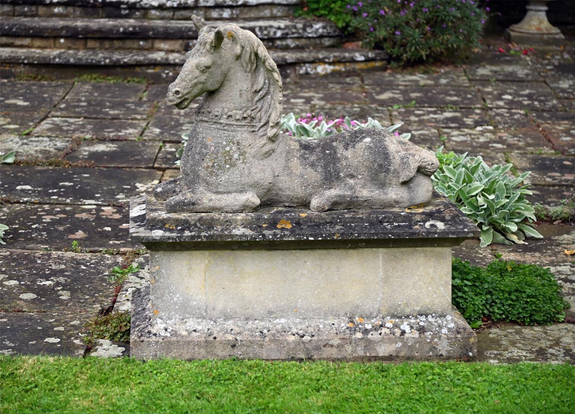 A PAIR OF COMPOSITION STONE MODELS OF RECUMBENT HORSES, 20TH CENTURY - Image 4 of 4