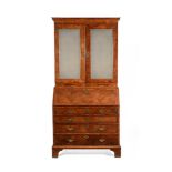 A GEORGE II WALNUT AND FEATHER BANDED BUREAU BOOKCASE, CIRCA 1740