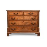 AN UNUSUAL GEORGE III BURR OAK AND CROSSBANDED CHEST OF DRAWERS, CIRCA 1770