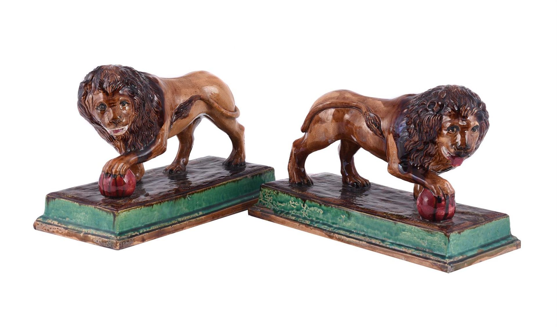 A PAIR OF GEORGE SKEY, WILNECOTE WORKS, TAMWORTH MAJOLICA MODELS OF MEDICI LIONS, LATE 19TH CENTURY